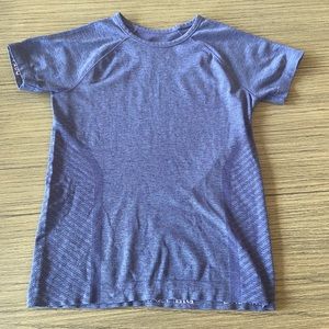 Athletics Girl Purple tight “powerful” shirt. *size girls L/12